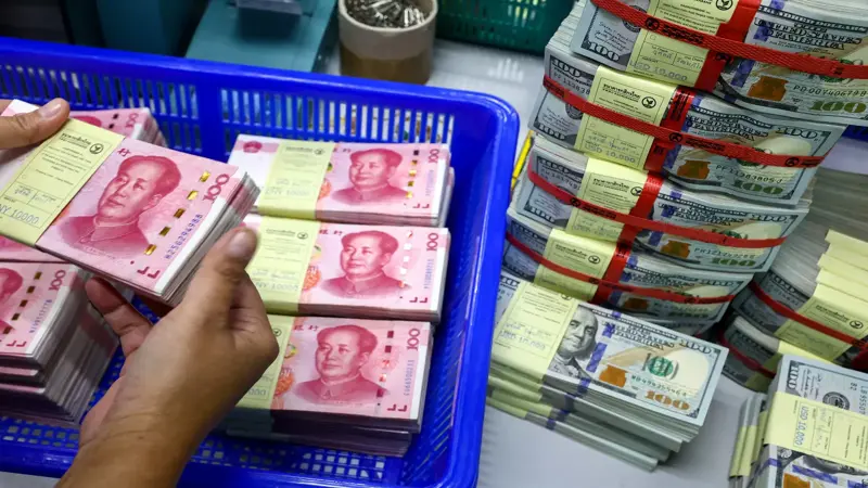 ورقة العملة.. كيف يطفئ اليوان الضعيف لهيب تعريفات ترامب؟
